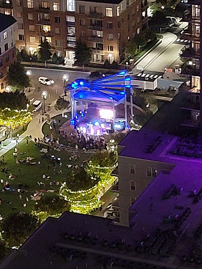 View from condo balcony of bandshell at night