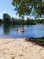 Two kayakers on a river