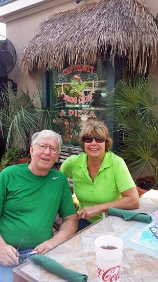 WIl and her husband at an outdoor restaurant