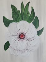 White flower with red center and green leaves